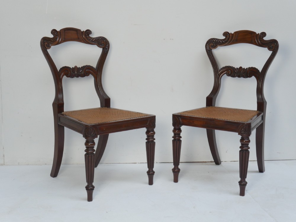 Pair of Regency mahogany side chairs with blue fabric seats and turned reeded legs. View XII