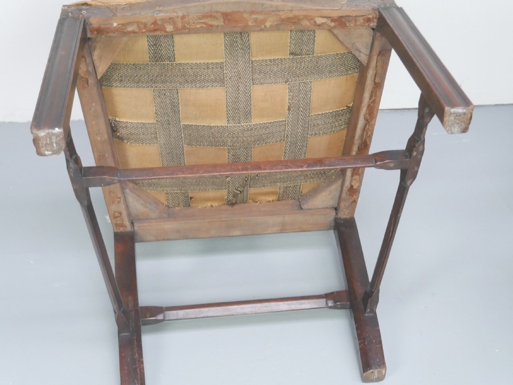 A set of eight dark mahogany Georgian style dining chairs featuring carved pierced splats and patterned fabric drop-in seats, comprising six side chairs and two carver armchairs. View VI