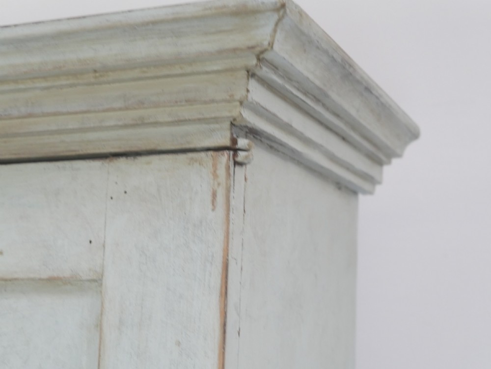 A tall two-tier Swedish softwood bureau cabinet with diamond panel moulding on the doors, a slanted fall-front flap, and a distressed pale grey painted finish. View VIII