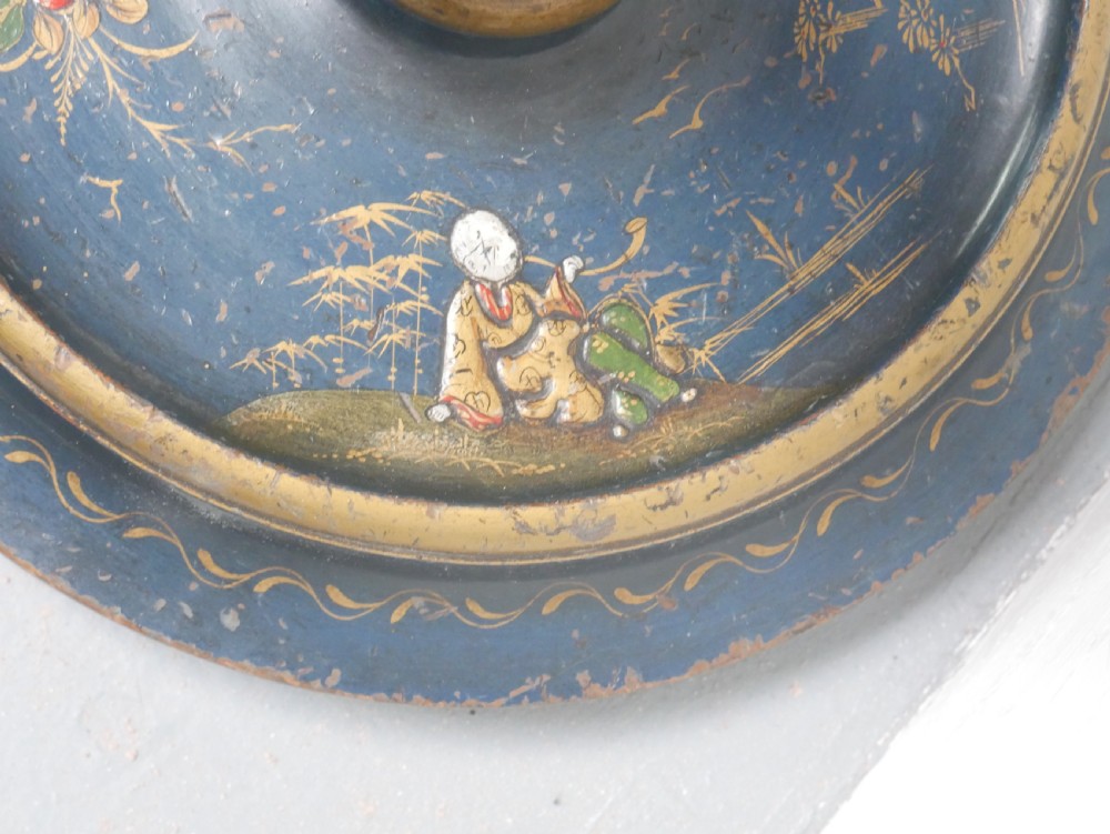 A tall turned wooden standard lamp painted dark blue with hand-painted gilt Chinoiserie botanical motifs and a circular base. View V