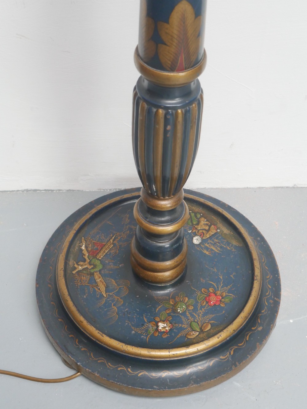 A tall turned wooden standard lamp painted dark blue with hand-painted gilt Chinoiserie botanical motifs and a circular base. View VIII