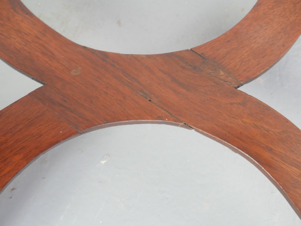 A matching pair of polished warm brown mahogany side tables featuring raised tray-top edges, turned legs, and curved X-stretchers. View IX