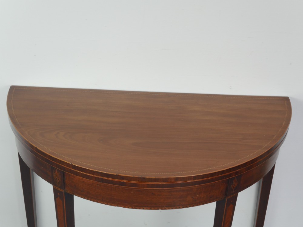 A Scottish Georgian mahogany demi-lune fold-over side table with inlaid square tapered legs. View II