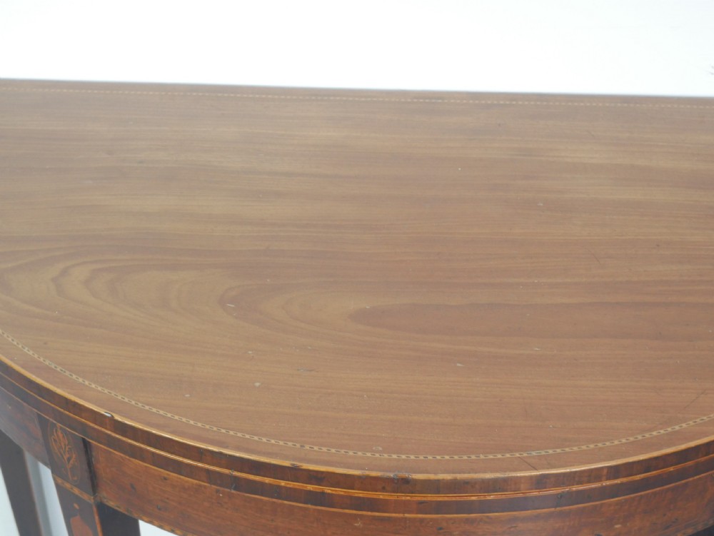 A Scottish Georgian mahogany demi-lune fold-over side table with inlaid square tapered legs. View IV