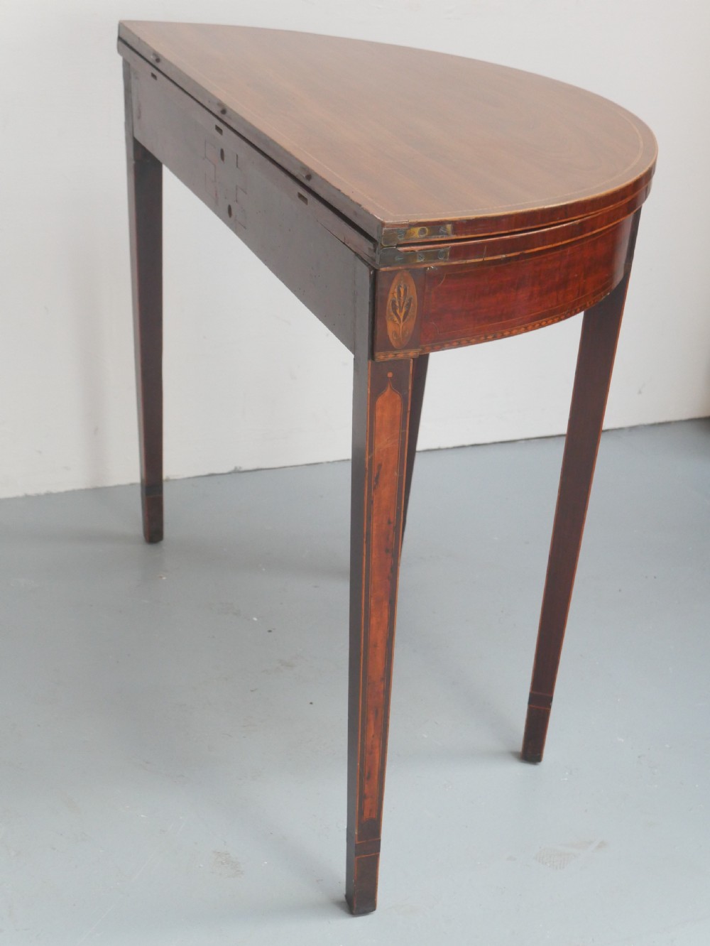 A Scottish Georgian mahogany demi-lune fold-over side table with inlaid square tapered legs. View VI