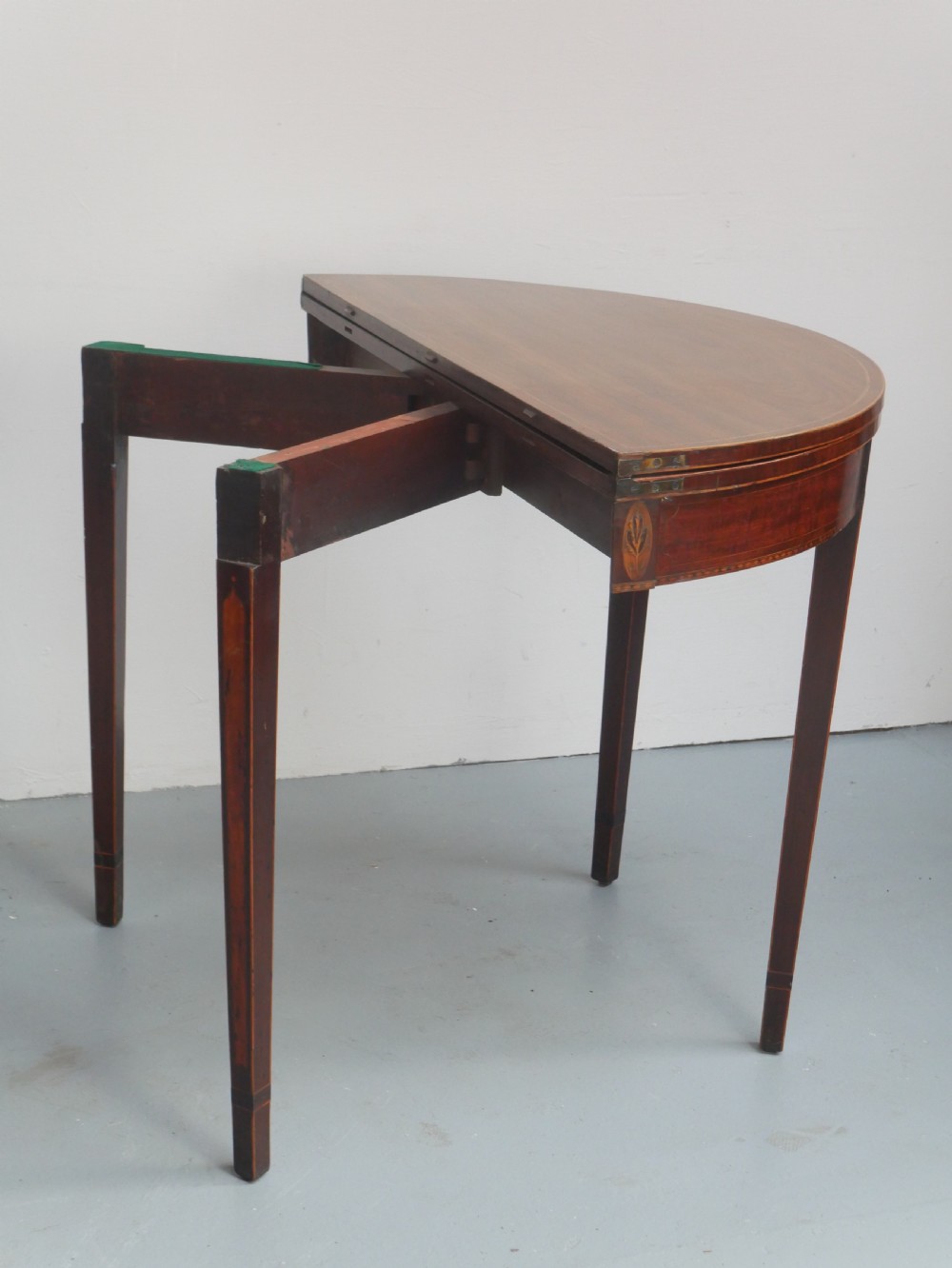 A Scottish Georgian mahogany demi-lune fold-over side table with inlaid square tapered legs. View VII