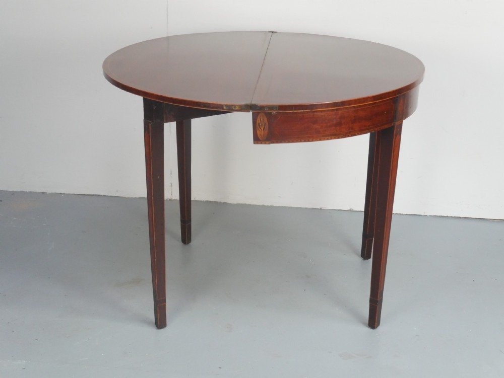 A Scottish Georgian mahogany demi-lune fold-over side table with inlaid square tapered legs. View VIII