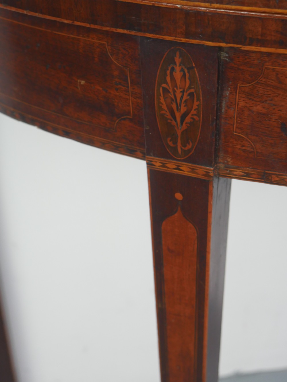 A Scottish Georgian mahogany demi-lune fold-over side table with inlaid square tapered legs. View X
