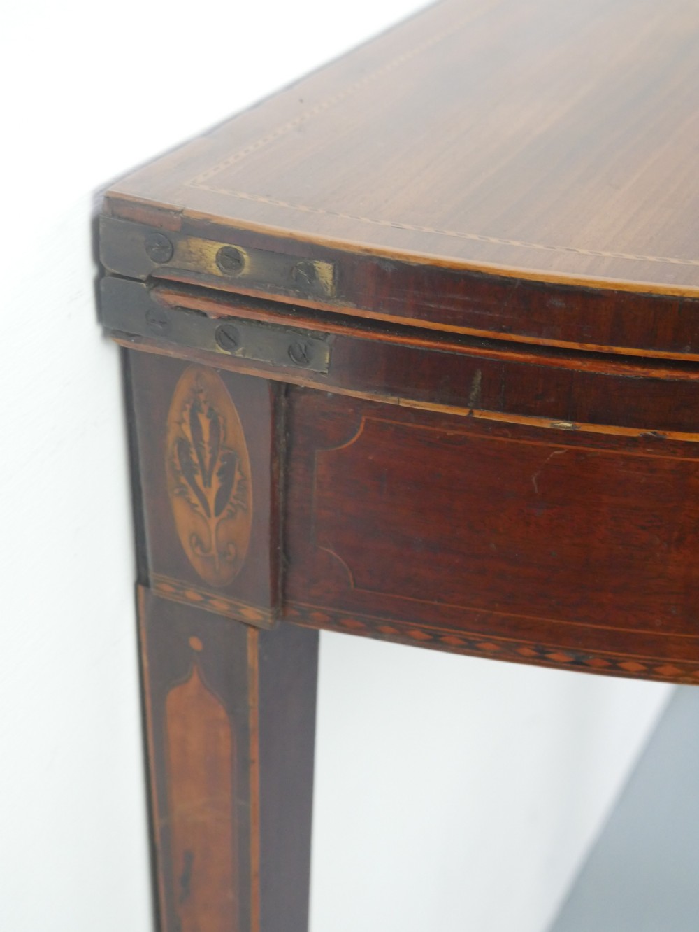A Scottish Georgian mahogany demi-lune fold-over side table with inlaid square tapered legs. View XII
