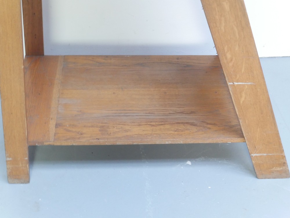 A tall freestanding oak library step ladder featuring multiple wide treads, shaped handholds at the top, and a warm natural wood finish. View VII