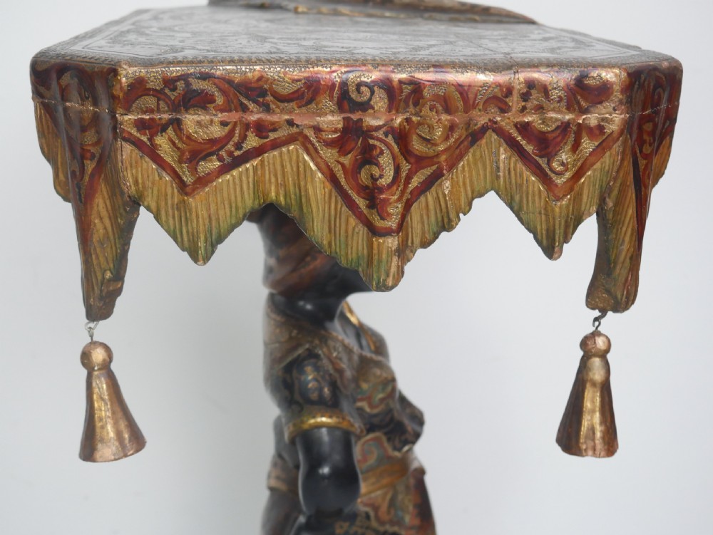 A 19th-century carved polychrome and gilded wooden Venetian side table depicting a figural stand supporting a draped canopy top with hanging tassels. View XI