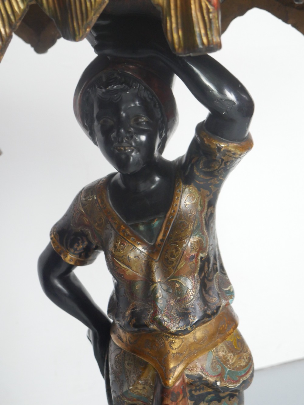 A 19th-century carved polychrome and gilded wooden Venetian side table depicting a figural stand supporting a draped canopy top with hanging tassels. View XIII