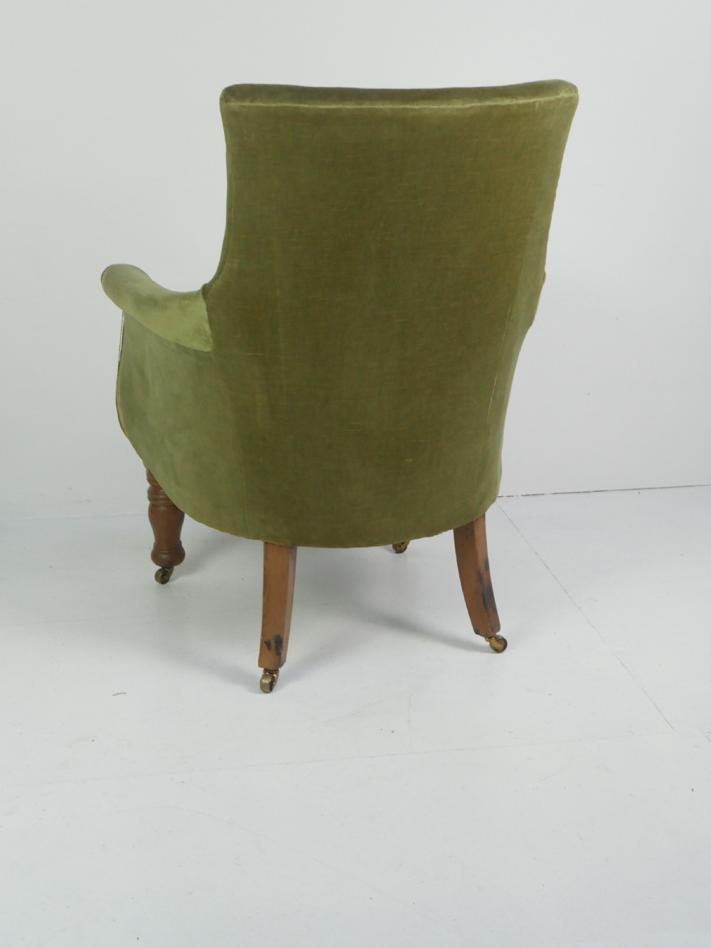 A Regency period style armchair upholstered in olive green velvet with floral needlepoint embroidery on the backrest and seat cushion. View V