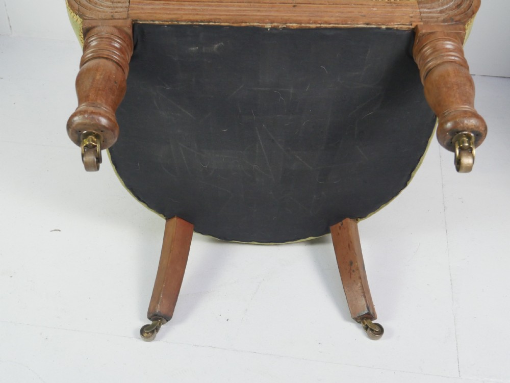 A Regency period style armchair upholstered in olive green velvet with floral needlepoint embroidery on the backrest and seat cushion. View VIII