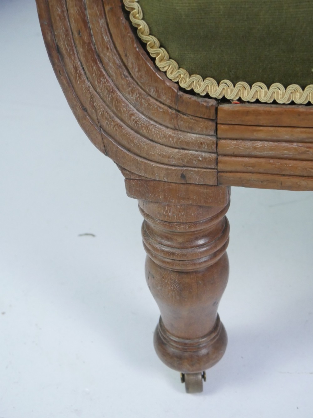 A Regency period style armchair upholstered in olive green velvet with floral needlepoint embroidery on the backrest and seat cushion. View XI