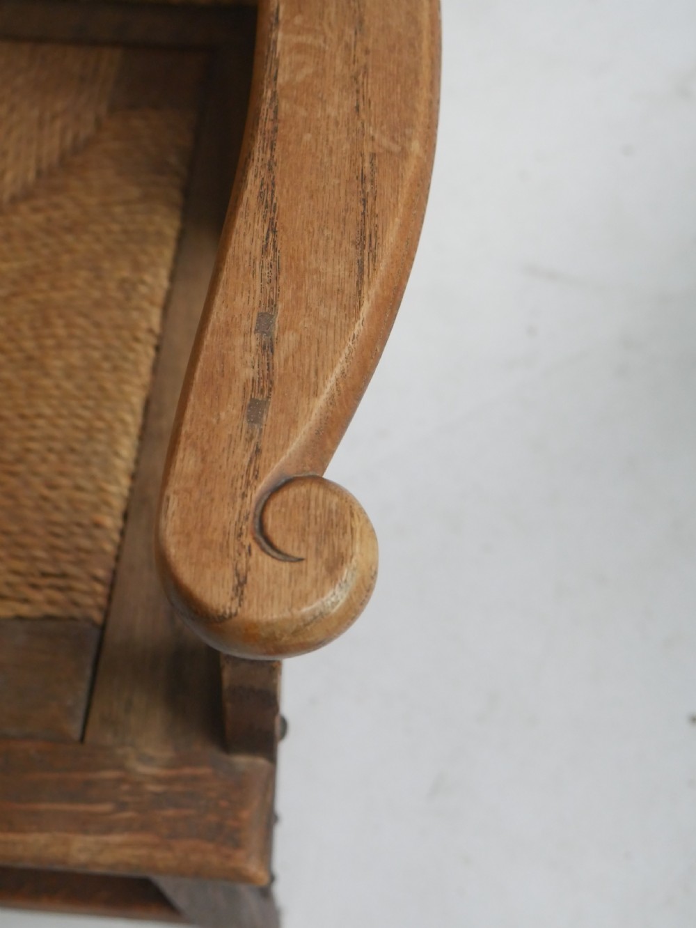 A traditional full-sized Scottish Orkney armchair featuring a timber oak frame, flat wooden armrests, a rush seat, and a tall hand-woven oat straw backrest. View VIII