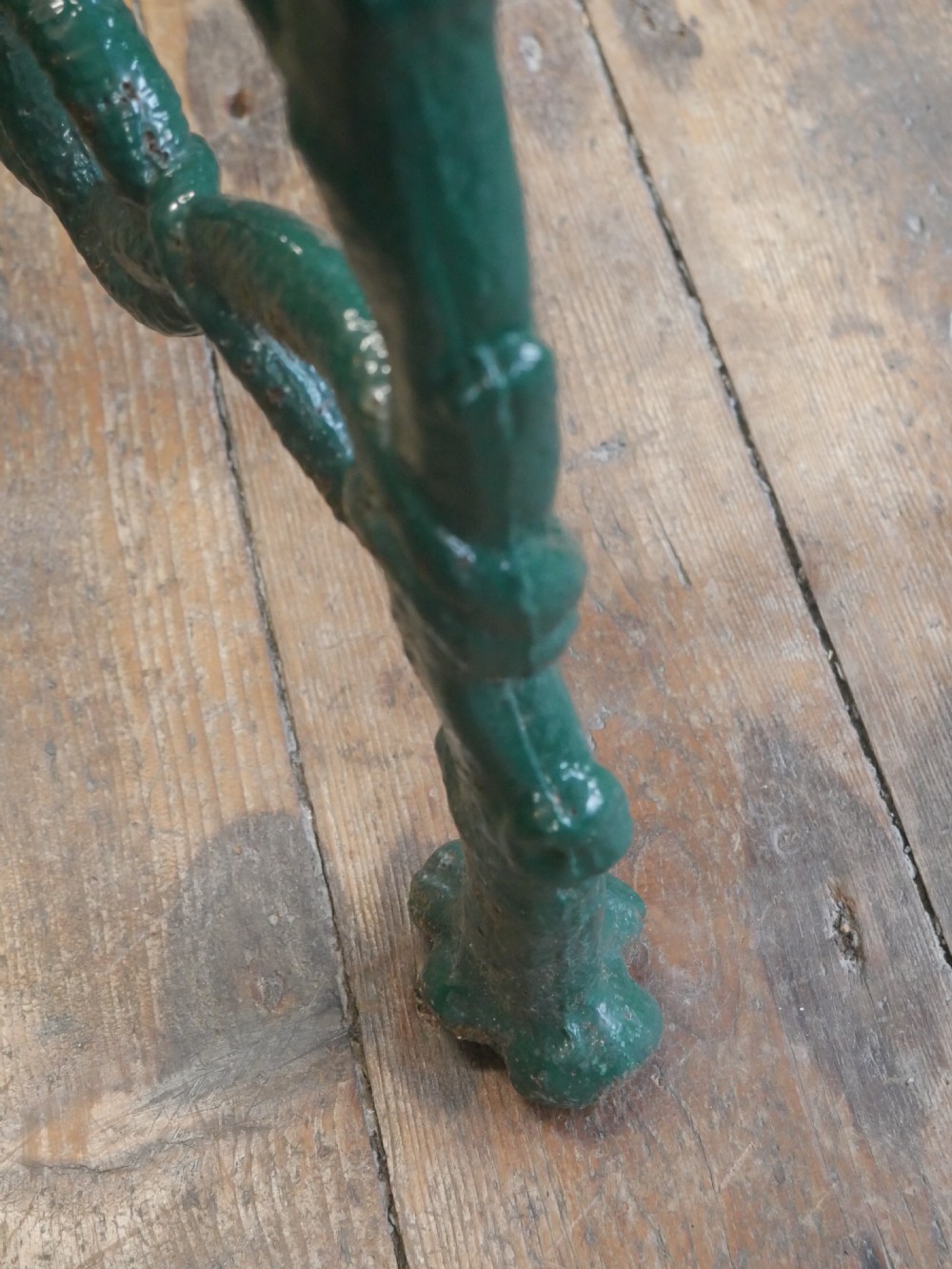 A green painted Victorian cast iron garden bench featuring a naturalistic organic branch and twig pattern. View XII