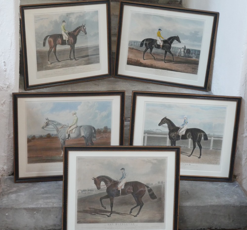 Set of five framed antique colour engravings depicting racehorses with jockeys in landscape settings. View XII