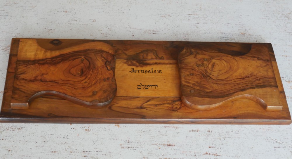 An olive wood extending book slide with hinged rounded ends and black printed text reading Jerusalem in English and Hebrew script. View III