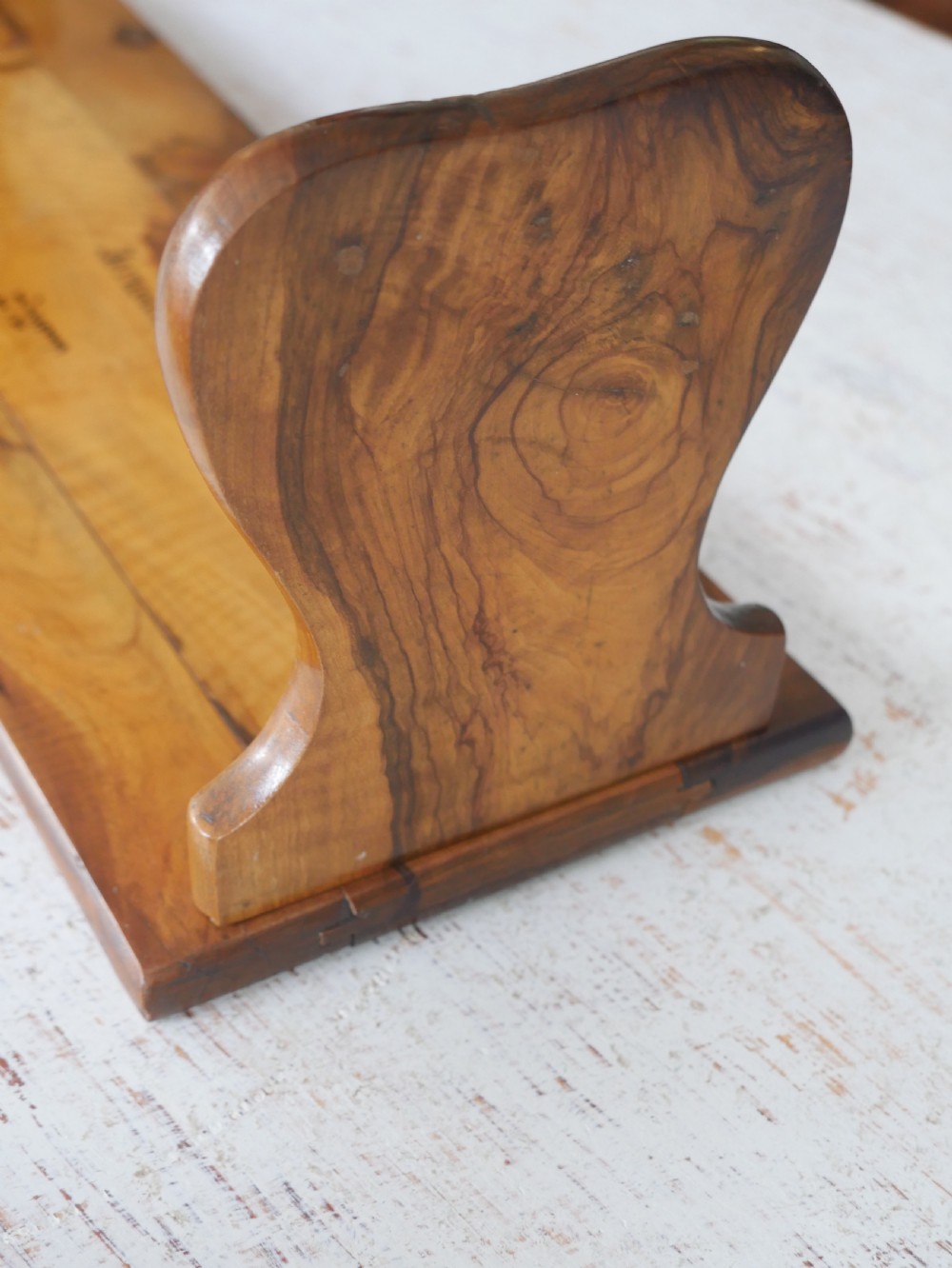 An olive wood extending book slide with hinged rounded ends and black printed text reading Jerusalem in English and Hebrew script. View IV