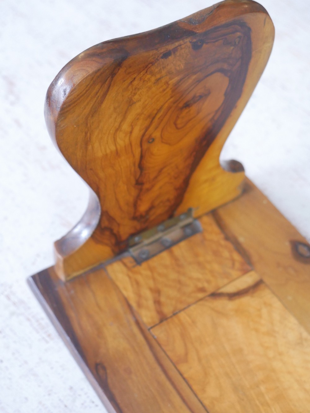 An olive wood extending book slide with hinged rounded ends and black printed text reading Jerusalem in English and Hebrew script. View V