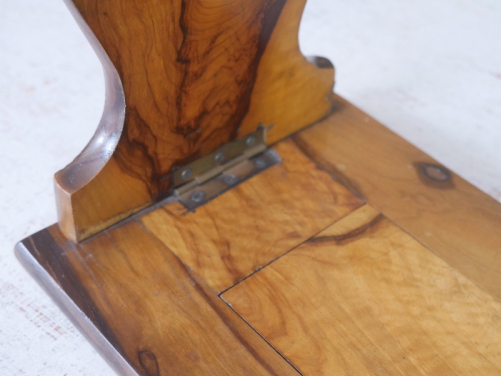 An olive wood extending book slide with hinged rounded ends and black printed text reading Jerusalem in English and Hebrew script. View VI