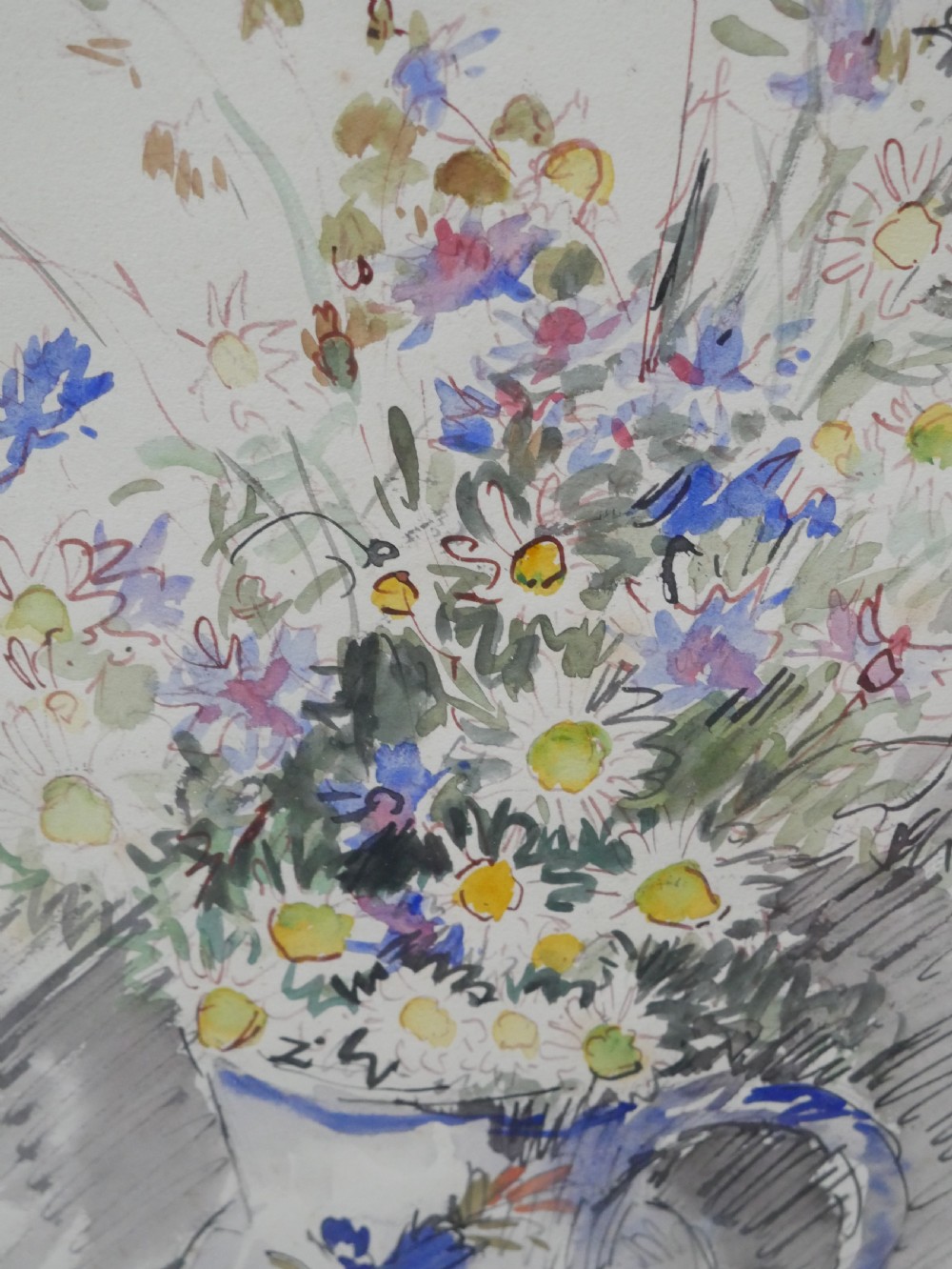 A framed floral watercolour still life painting depicting a bouquet of summer wildflowers in a ceramic jug within a carved giltwood frame. View III