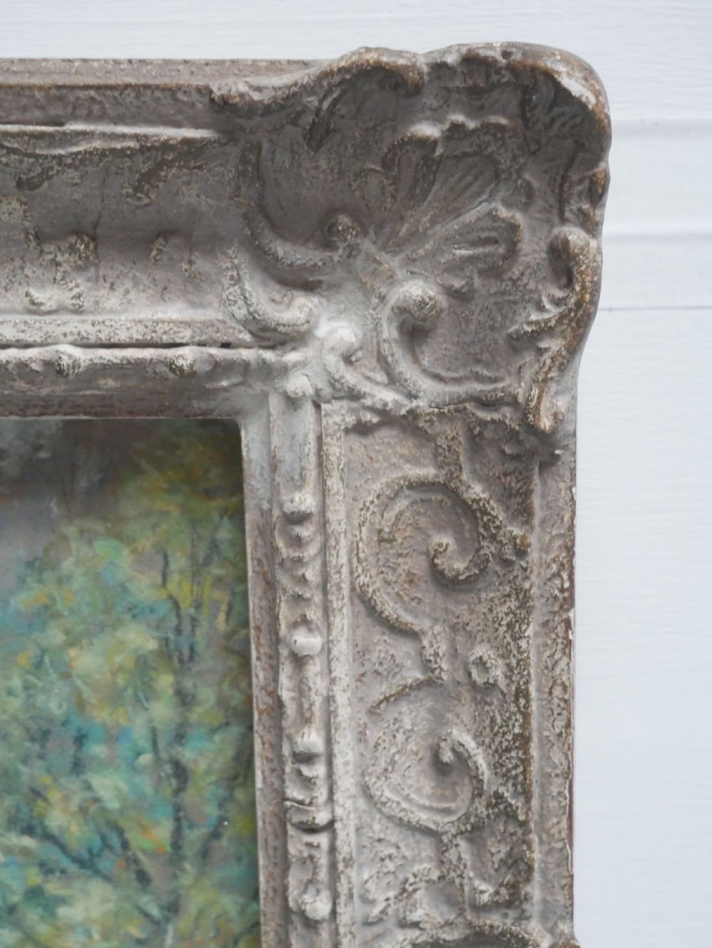 An antique pastel painting depicting an autumn woodland landscape, presented within a carved off-white frame. View IV