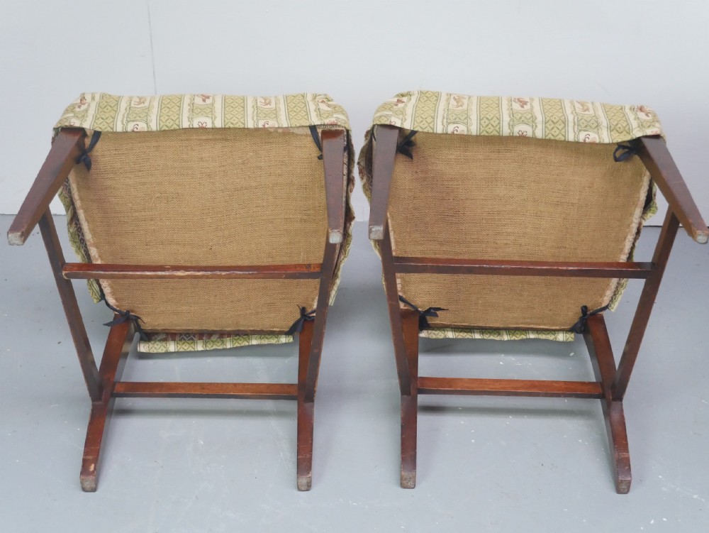 A set of four Scottish Georgian mahogany dining chairs featuring carved bow splats, square legs with stretchers, and green and cream patterned upholstery. View V