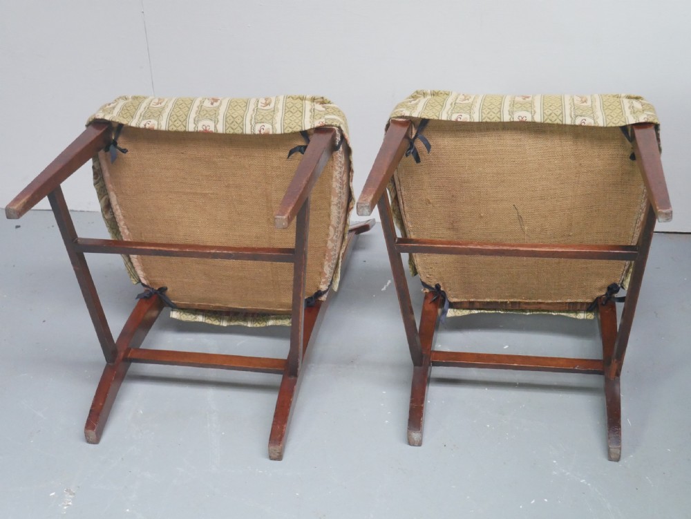 A set of four Scottish Georgian mahogany dining chairs featuring carved bow splats, square legs with stretchers, and green and cream patterned upholstery. View VI