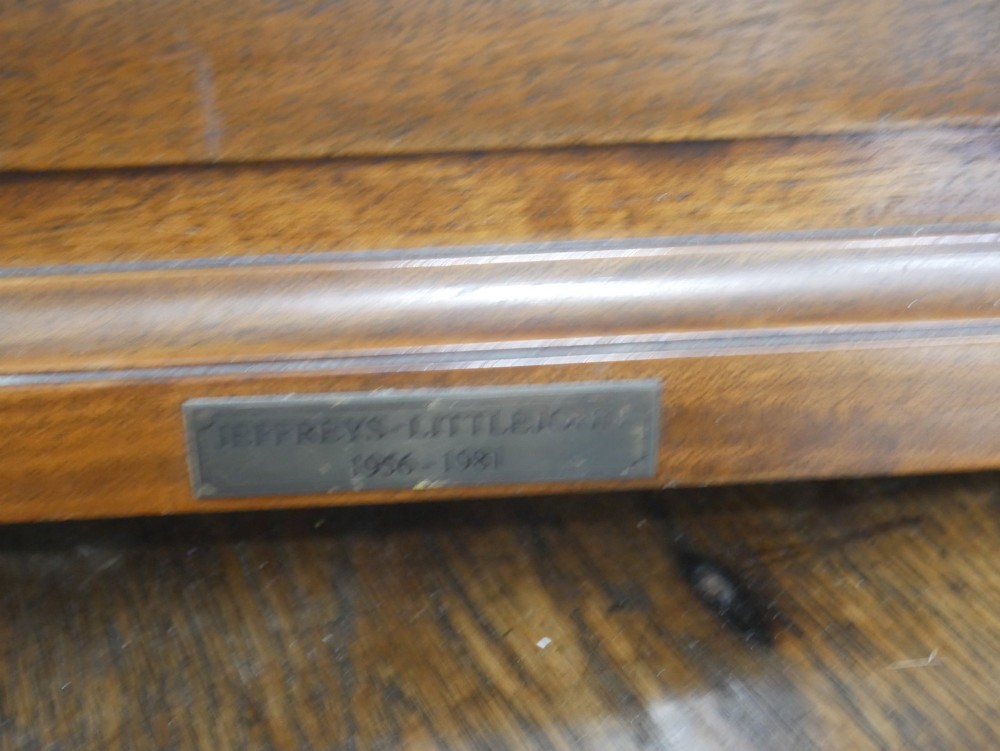 A Georgian mahogany bracket clock featuring an arched top with a brass handle, white dial with Roman numerals, and strike silent sub-dial. View XII