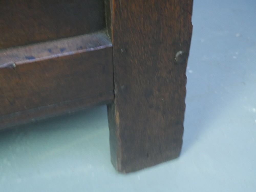 A dark brown oak coffer featuring a carved fluted frieze, double front panels, and a hinged lid with carved geometric border details. View VII