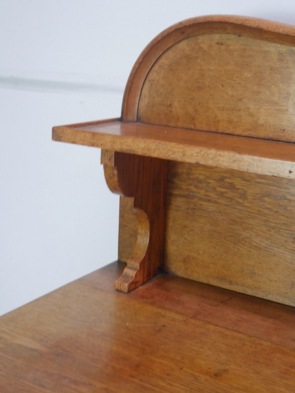 A large Victorian oak serving table featuring a raised back gallery shelf, frieze drawers, and turned front legs. View XI