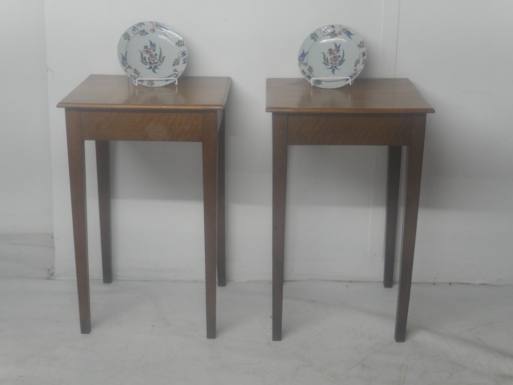 A pair of matching square wooden lamp tables made from warm brown oak, featuring square tops and simple tapered legs. View II