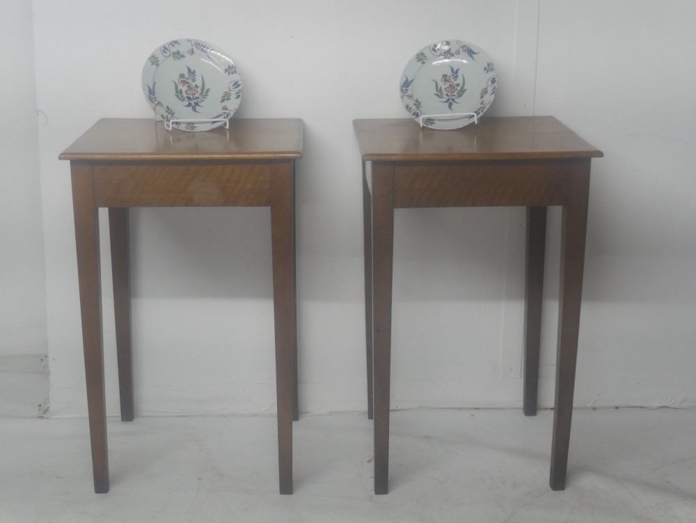A pair of matching square wooden lamp tables made from warm brown oak, featuring square tops and simple tapered legs. View VII