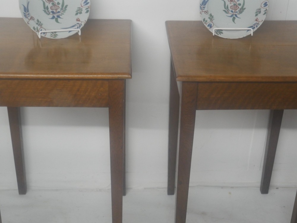 A pair of matching square wooden lamp tables made from warm brown oak, featuring square tops and simple tapered legs. View VIII