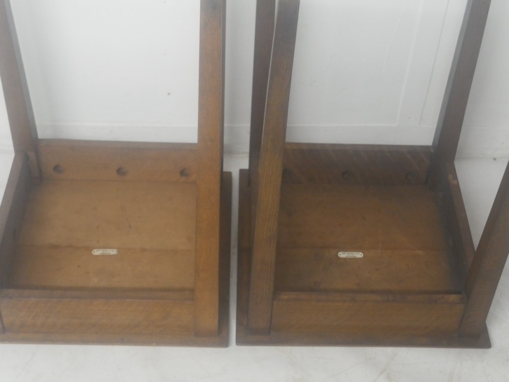 A pair of matching square wooden lamp tables made from warm brown oak, featuring square tops and simple tapered legs. View IX