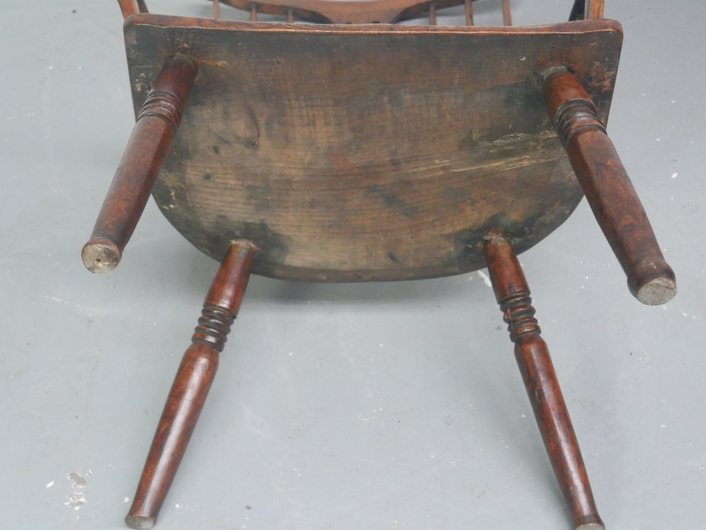 A Georgian comb back Windsor armchair featuring vertical wooden spindles, a pierced central splat, curved armrests, and turned legs. View XV