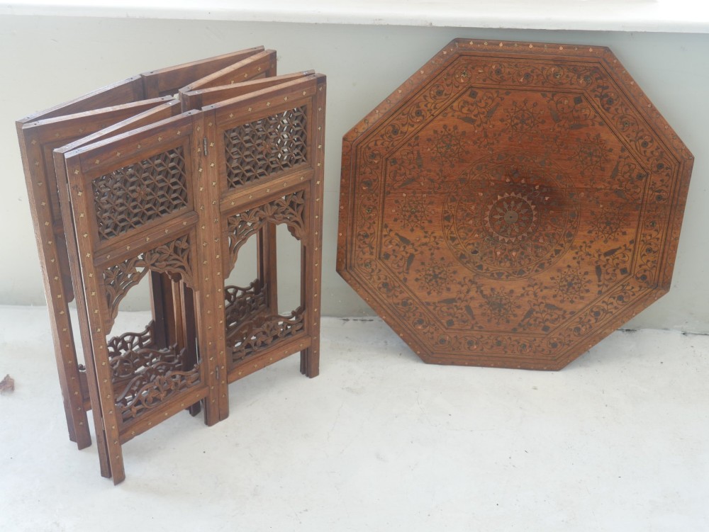 An octagonal Anglo-Indian dark wood side table decorated with intricate bone inlay patterns and pierced jali lattice arches. View III