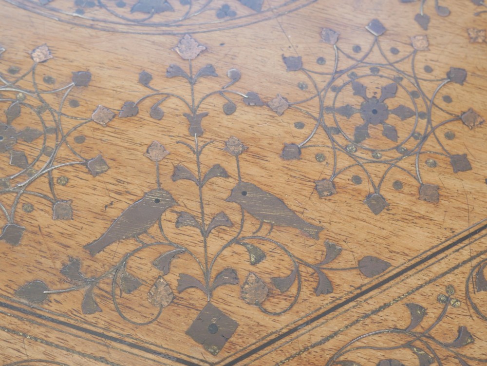 An octagonal Anglo-Indian dark wood side table decorated with intricate bone inlay patterns and pierced jali lattice arches. View IV