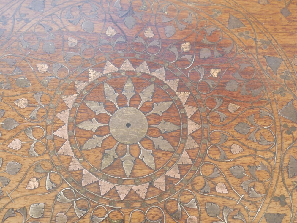 An octagonal Anglo-Indian dark wood side table decorated with intricate bone inlay patterns and pierced jali lattice arches. View V