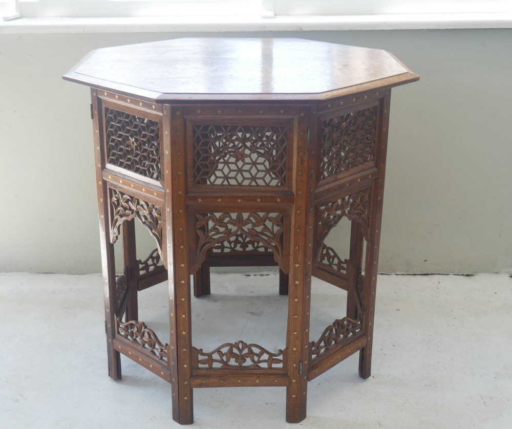 An octagonal Anglo-Indian dark wood side table decorated with intricate bone inlay patterns and pierced jali lattice arches. View IX