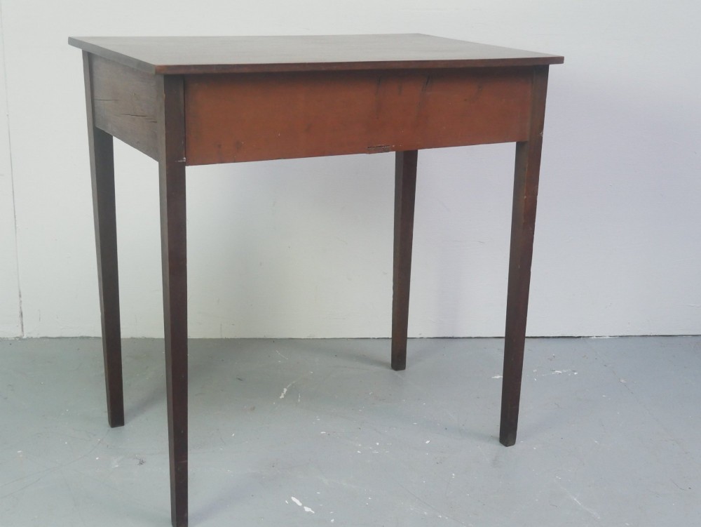 A rectangular Georgian mahogany side table with two frieze drawers, circular brass knobs, and four straight tapered legs. View VIII