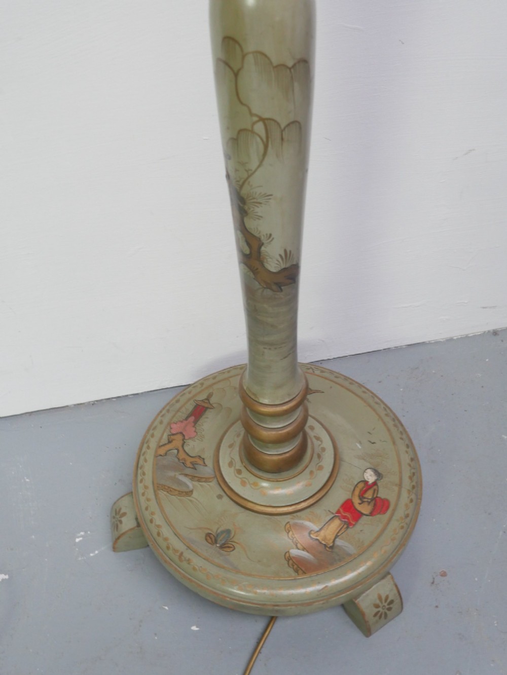 A tall turned wood standard floor lamp featuring hand-painted sage green chinoiserie decoration with figures, floral motifs, and gilt highlights. View II