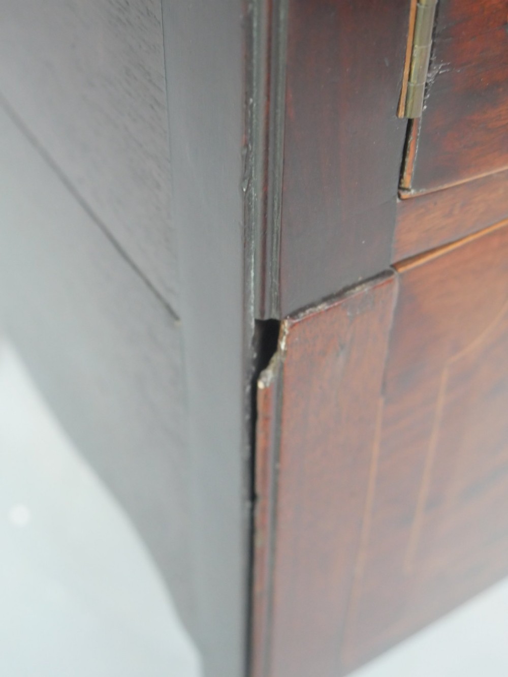 A Georgian mahogany bedside cabinet with a tray top gallery, double inlaid cupboard doors, a lower drawer, and square legs. View VIII
