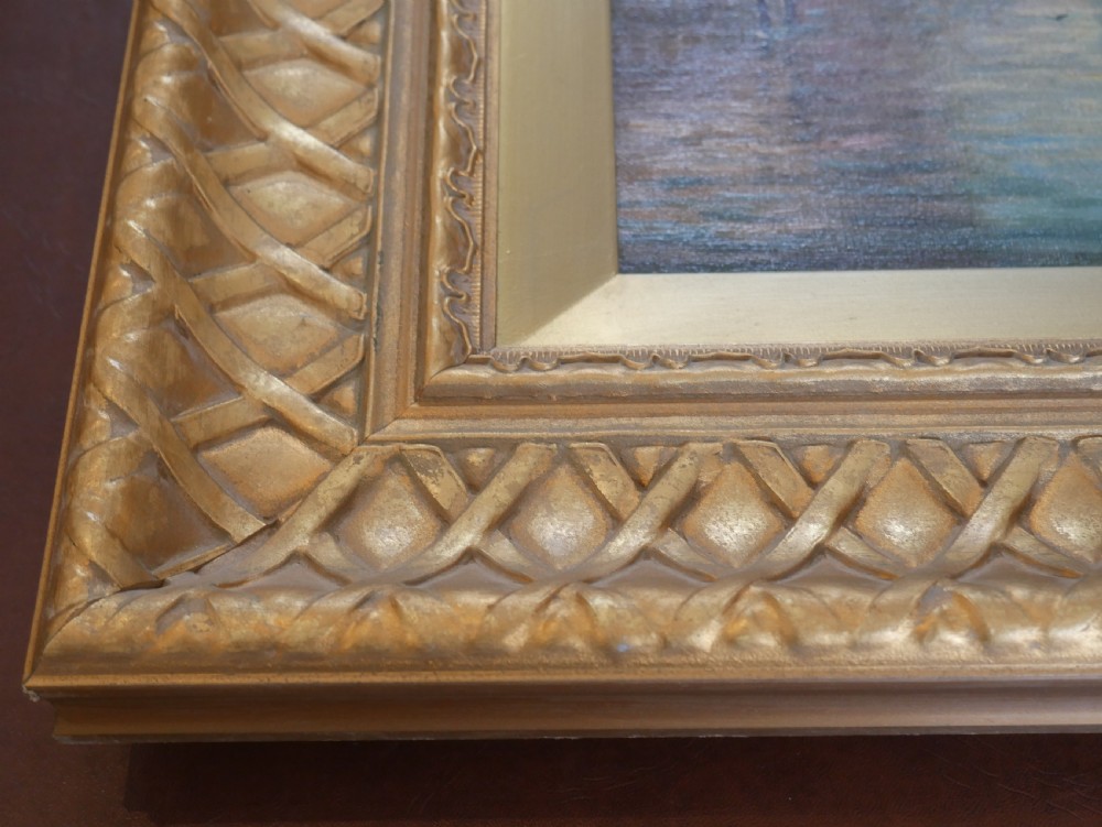 An antique oil painting depicting the Grand Canal in Venice with gondolas and historic buildings, encased in a textured gold gilded frame. View VI