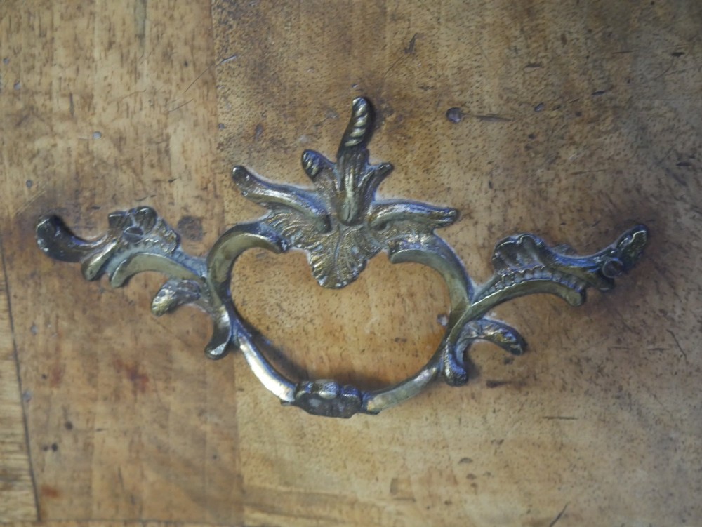 An 18th-century Swedish wooden commode featuring two bow-fronted drawers, ornamental brass handles, escutcheons, and curved lower legs. View IV