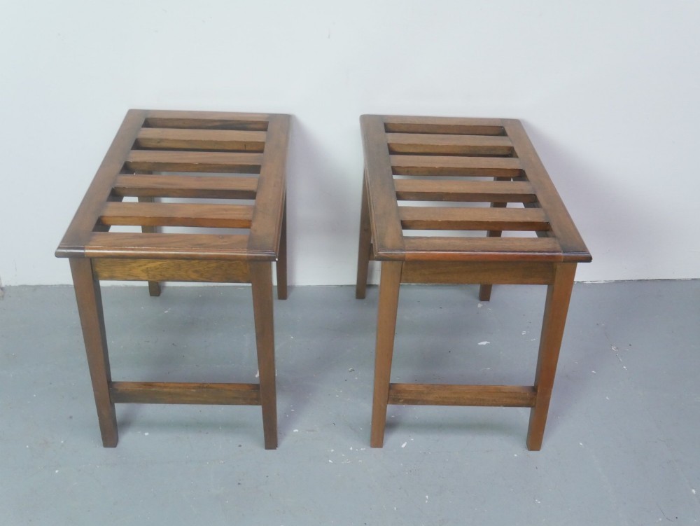 A pair of rectangular warm brown walnut luggage racks featuring slatted tops, straight stretchers, and tapered legs. View V
