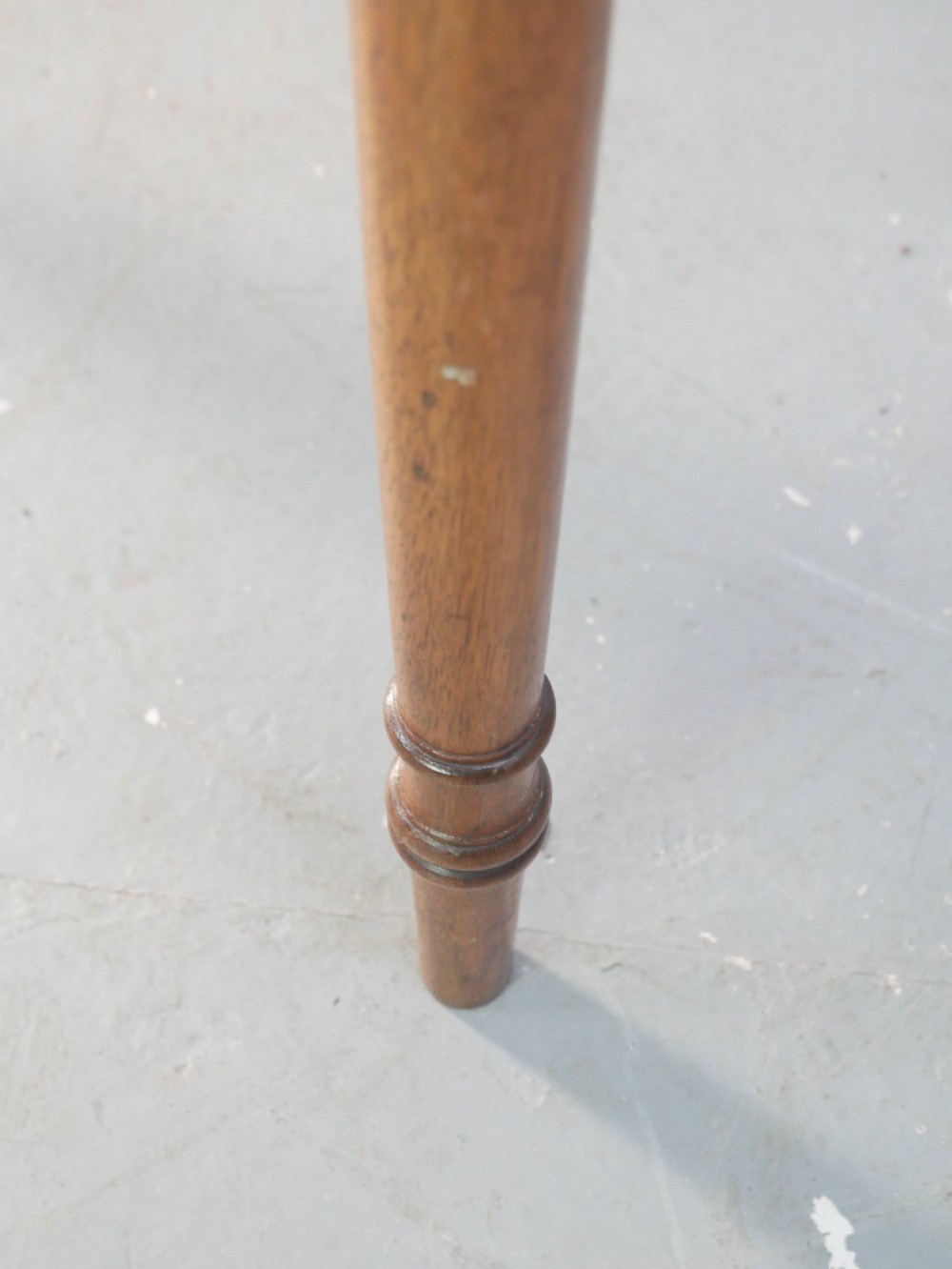 A small Regency mahogany side cabinet featuring flame mahogany drawer fronts, brass knob handles, inlaid borders, and slender turned legs. View IV
