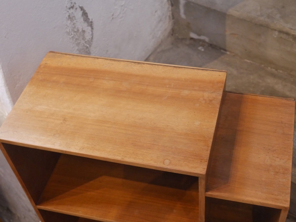 A group of three rectilinear open wooden display boxes with warm timber grain. View V